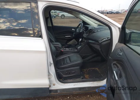 2016 Ford Escape Titanium z USA, uszkodzony, nr VIN 1FMCU0J91GUB06941